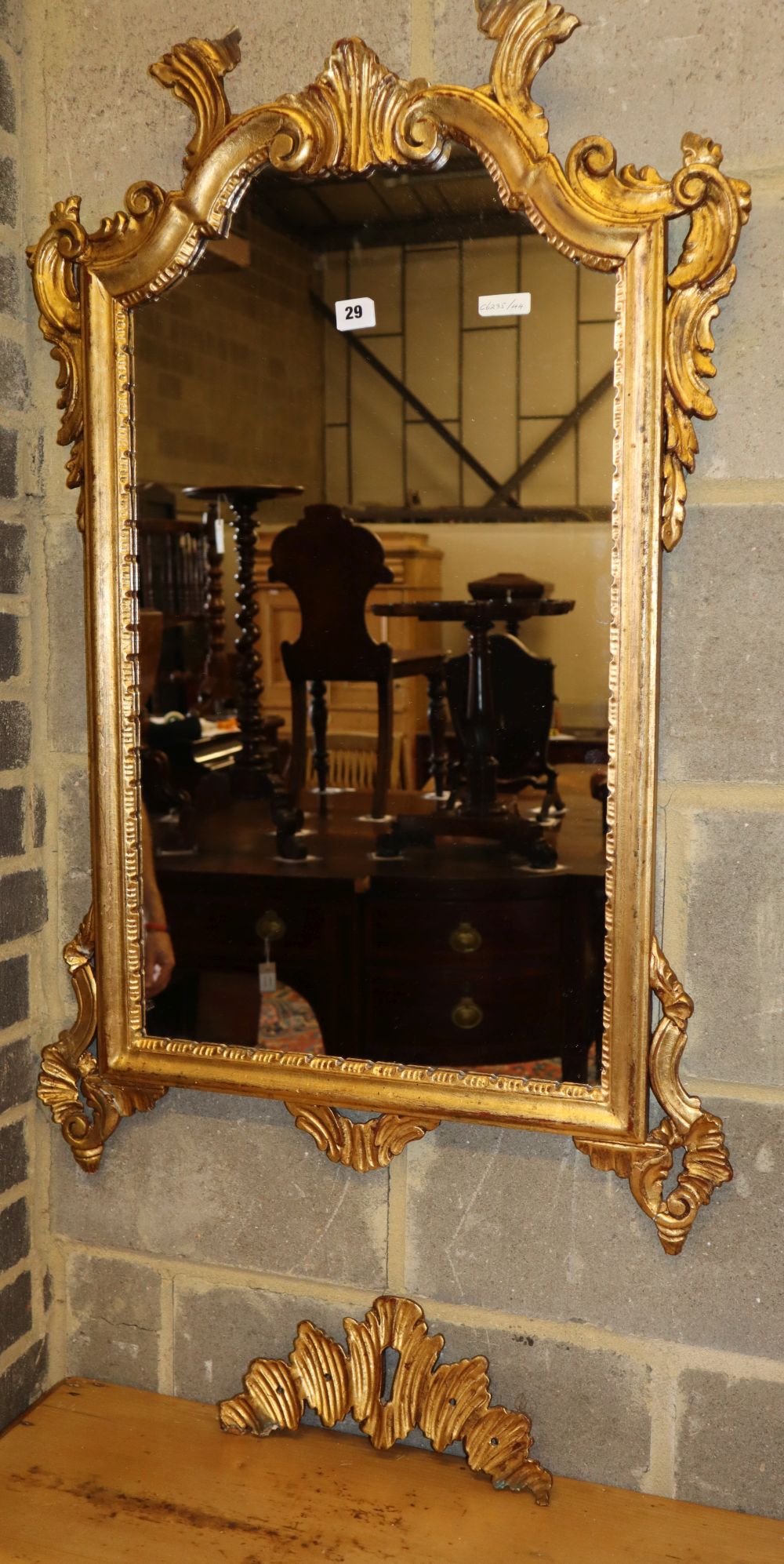 An 18th century style giltwood and gesso rectangular wall mirror, W.62cm, H.104cm. (frame in need of repair)